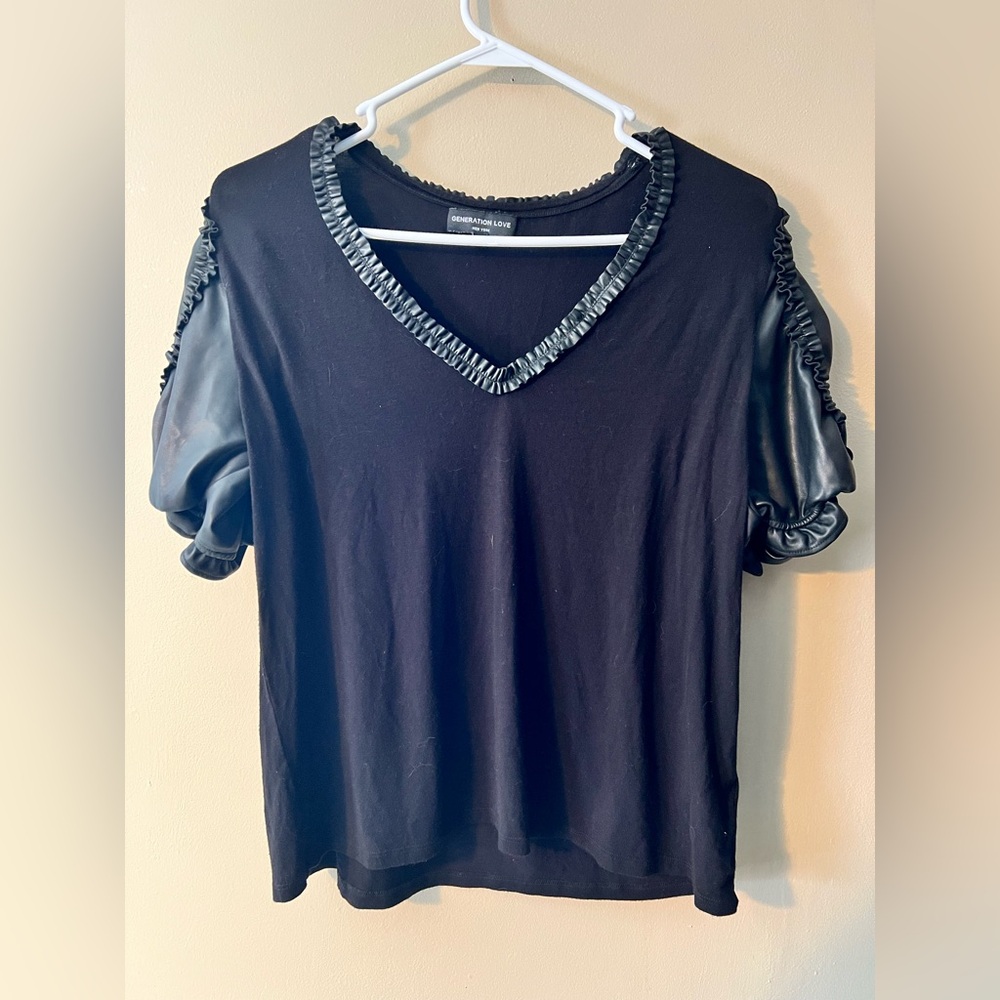 Generation Love sz L v neck black top with faux leather trim and puffed sleeves.